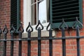 Pretty heart design in black wrought iron fencing at the property border of country home