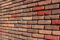 Length of red and brown brick wall showcases craftsmanship of mason who constructed it Royalty Free Stock Photo