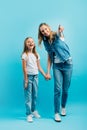 Length view of excited girl holding