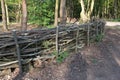 A barrier or fence made from lengths of brushwood and timber. Royalty Free Stock Photo