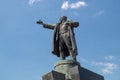 Lenin monument close up against the blue sky