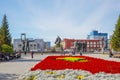 Lenin square with a blossoming flowerbed. Novosibirsk, Russia