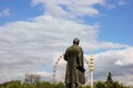 Lenin statue looking at Ferris wheel, Moscow Royalty Free Stock Photo
