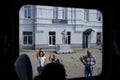 Lenin statue and people seeing off their relatives in Mikhaylov of Ryazan region, Russia.