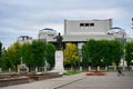 Lenin statue with the Three Nations Theater building on the city square in Nalchik Royalty Free Stock Photo