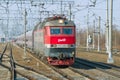 The Czech two-section electric locomotive of ChS7-233 with the passenger train close up