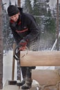 Leningrad Region, Russia - February 2, 2010: Woodworker makes a