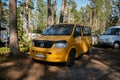 Leningrad Region, Russia - June 2022. Festival of mobile homes in coniferous forest. A homemade mobile home based on