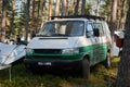 Leningrad Region, Russia - June 2022. Stylish green and white Volkswagen transporter T4 with expedition trunk - house on