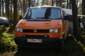 Leningrad Region, Russia - June 2022. Stylish orange Volkswagen transporter T4 - house on wheels from minivan. Front