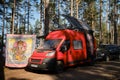 Leningrad Region, Russia - June 2022. Stylish red homemade fiat ducato mobile home with large solar panel on roof. A