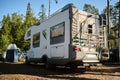 Leningrad Region, Russia - June 2022. Stylish white modern mobile home based on Ford Transit, rear view. The bus for