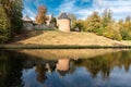 Lennik, Flemish Brabant Region, Belgium - The medieval tower of the Gaasbeek castle reflecting in the water pond with