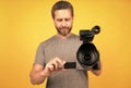 lens of camcorder held by man videographer making movie for vlog, selective focus, vlogging