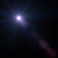 Lens flare effect over black background Royalty Free Stock Photo