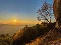 LENS FLARE: Golden autumn evening sun shines on a famous rock-climbing spot. Royalty Free Stock Photo