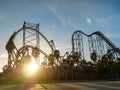 LENS FLARE: Golden sunbeams illuminate the massive frame of roller coaster ride