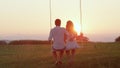 LENS FLARE,SILHOUETTE Romantic young couple watching sunset on spring evening. Royalty Free Stock Photo