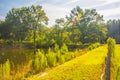 Lens flare from the sun over a beautiful a green landscape Royalty Free Stock Photo