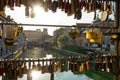 LENS FLARE: Sunbeams shine on lockets locked on a bridge in downtown Ljubljana