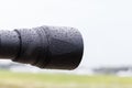 Lens hood in the rain, raindrops on black plastic