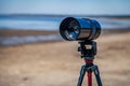Lens on a tripod Royalty Free Stock Photo