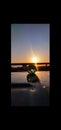 Lensball glowing in sunrise and water reflection Royalty Free Stock Photo