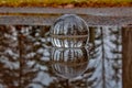 Lensball In A Puddle Of Water Royalty Free Stock Photo