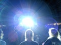 Lense flare from stage as Mike Love Sings into Mic as band jams on stage at Wanderlust Festival