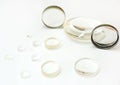 Lenses. Magnifying optical lenses close- up on a white background. Glass magnifiers isolated on a white background. Royalty Free Stock Photo