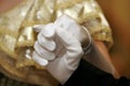 Close-up shot of two dancers` gloved hands dancing a waltz