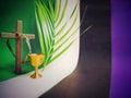 Lent Season and Holy Week Concept - palm leaf,chalice,crown of thorns and wooden cross with multicolored background. Royalty Free Stock Photo