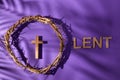 Lent season, Holy week and Good friday concept. Crown of torns and cross on purple background Royalty Free Stock Photo