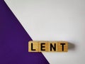 Lent Season,Holy Week and Good Friday concepts - LENT word on wooden blocks in white and purple color background. Stock photo. Royalty Free Stock Photo