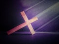 Lent Season,Holy Week and Good Friday concepts - photo of wooden cross leaning on floor in purple vintage background Royalty Free Stock Photo