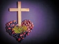 Lent Season,Holy Week and Good Friday concepts - photo of wooden cross with palm leaves and stones in purple vintage background Royalty Free Stock Photo