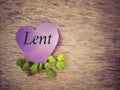 Lent Season, Holy Week and Good Friday concepts - Lent text on purple heart shape paper with flora background. Stock photo.