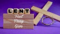 Lent Season,Holy Week and Good Friday concepts - text & x27;lent fast pray give& x27; on wooden blocks in purple vintage Royalty Free Stock Photo