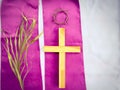 Lent Season,Holy Week and Good Friday Concepts - wooden cross on purple cloth in vintage background. Stock photo. Royalty Free Stock Photo