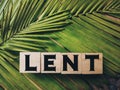 Lent Season,Holy Week and Good Friday concepts - word lent on wooden blocks in green vintage background. Stock photo. Royalty Free Stock Photo