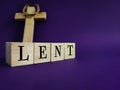 Lent Season,Holy Week and Good Friday concepts - word LENT on wooden blocks in purple vintage background. Stock photo. Royalty Free Stock Photo