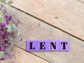 Lent Season,Holy Week and Good Friday concepts - word lent on purple wooden blocks in vintage background. Stock photo.