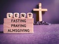 Lent Season,Holy Week and Good Friday concepts - words ' lent fasting praying almsgiving' text background. Stock photo.