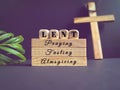 Lent Season,Holy Week and Good Friday concepts - 'lent praying fasting almsgiving' text background. Stock photo.