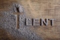 Lent word written in ash, dust as fast and abstinence period concept. Top view Royalty Free Stock Photo