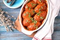Lenten rice cutlets with onions, carrots, cabbage and mushrooms baked in tomato sauce. Royalty Free Stock Photo