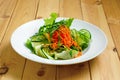 Lenten salad with cucumber, spicy carrot, arugula and sesame