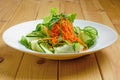 Lenten salad with cucumber, spicy carrot, arugula and sesame