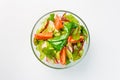 Lenten salad with lettuce, radishes and tomatoes on a white background