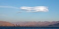 Lenticular cloud hovering above drought stricken Lake Isabella in the southern range of California's Sierra Nevada mountains